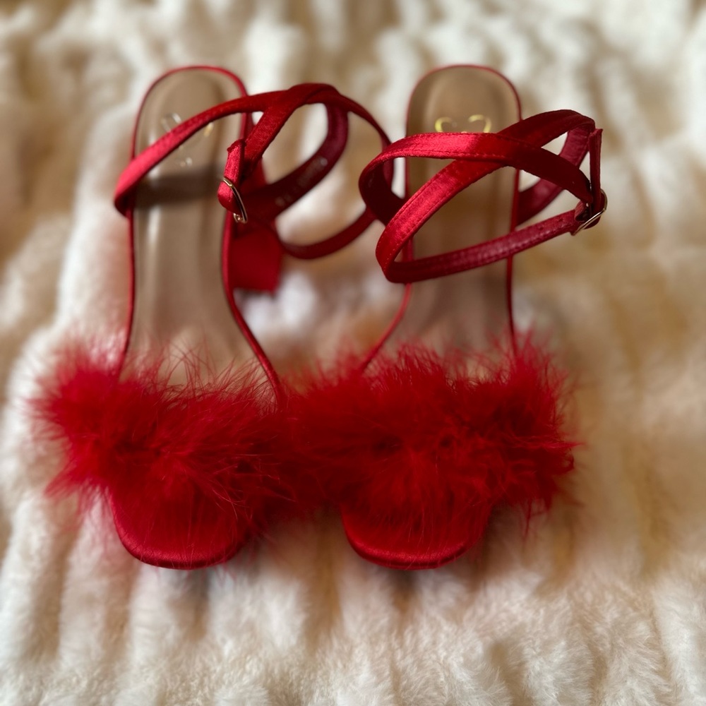 New never worn red feather heels